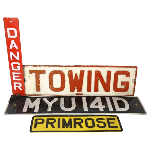 224 - A group of Vintage and modern signs, including an aluminium towing plate, a Vintage aluminium number... 