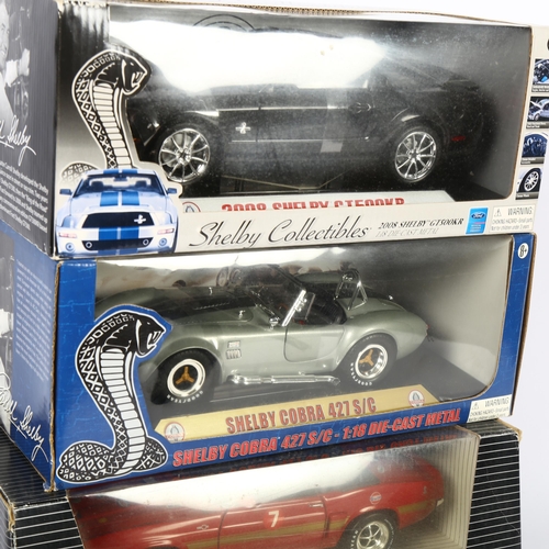 26 - SHELBY - a group of 3 x 1:18 scale diecast vehicles, in original boxes, some with associated display... 