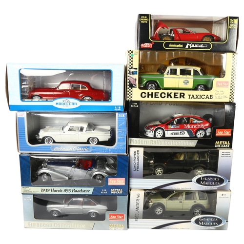 33 - A quantity of 1:18 scale diecast models, in original boxes, some with associated display stands, inc... 