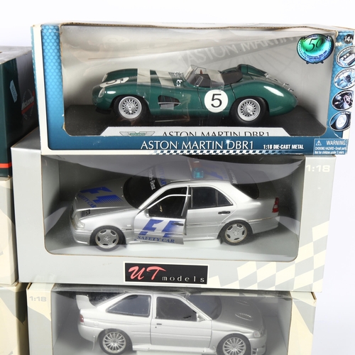 35 - UT MODELS - a group of 1:18 scale diecast models, in original boxes, including Ford Escort RS Coswor... 