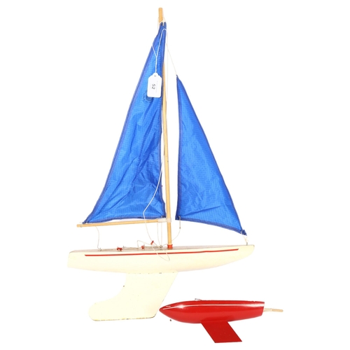 52 - SKIPPIER YACHTS - a Vintage Skipper pond yacht, with blue sails, yacht length 38cm, and 1 other smal... 
