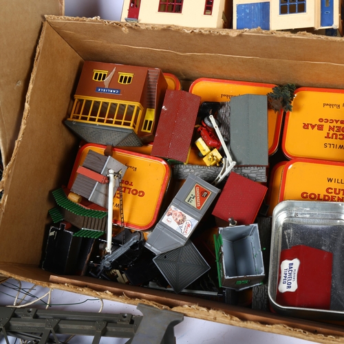 60 - A quantity of Vintage railway toys, including many plastic buildings and associated accessories rela... 