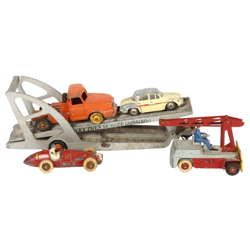 62 - DINKY - a Dinky Supertoys 39A Transporter, French model, and 3 additional Dinky vehicles, all French... 