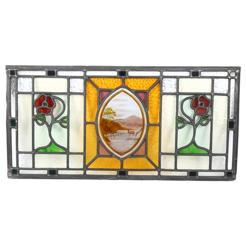 283 - A stained glass leadlight window panel (unframed), hte stag decorated central oval panel flanked by ... 