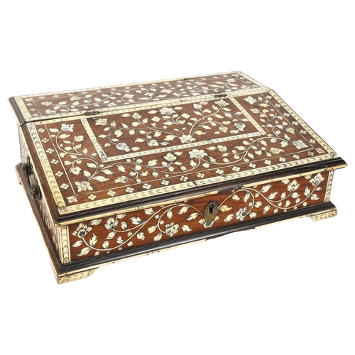 287 - A 19th century Indo-Portuguese writing box, teak and floral ivory inlaid, the rising top revealing a... 