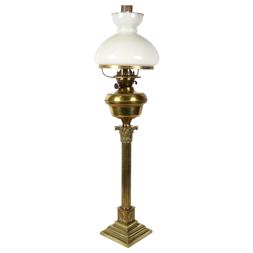 293 - ELTEX - a brass Corinthian column table lamp with milk glass shade, H86cm