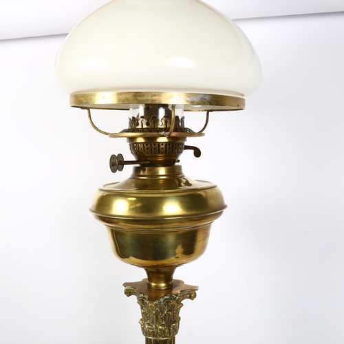 293 - ELTEX - a brass Corinthian column table lamp with milk glass shade, H86cm