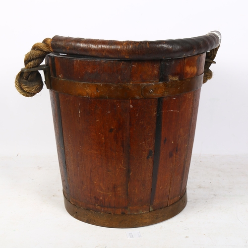 300 - A 19th century Naval fire bucket with leather-clad rope twist handle, H31cm