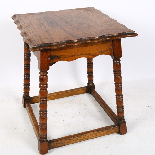 301 - A small oak occasional table, with shaped edge on ring turned legs, 26cm x 31cm