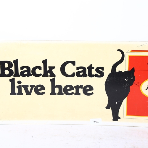 313 - A Black Cats Live Here advertising sign, 28 x 70cm, in perspex