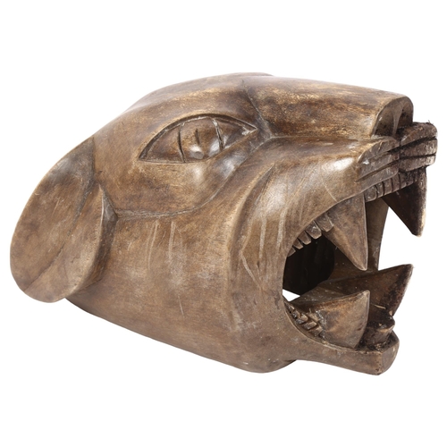 324 - A carved hardwood mask of a tiger, H17cm