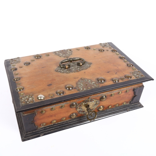 342 - A 19th century walnut and ebony travelling box, studded brass mounted, with fitted interior, with br... 