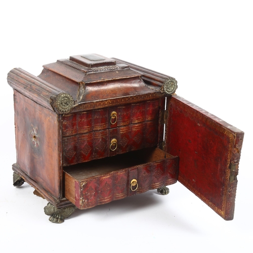 351 - A Regency tooled leather-covered sarcophagus design jewellery box, the door opening to reveal 3 fitt... 