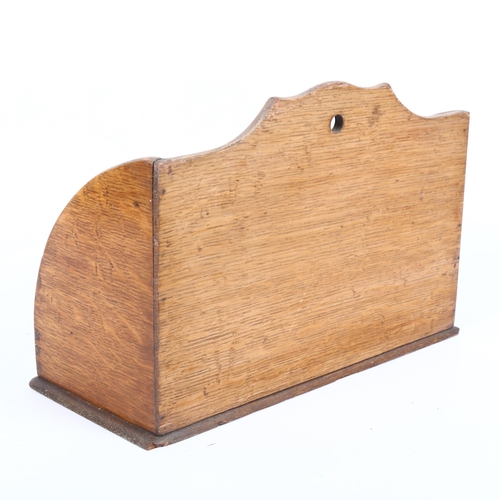 352 - An early 20th century oak letter/stationery rack, W31cm