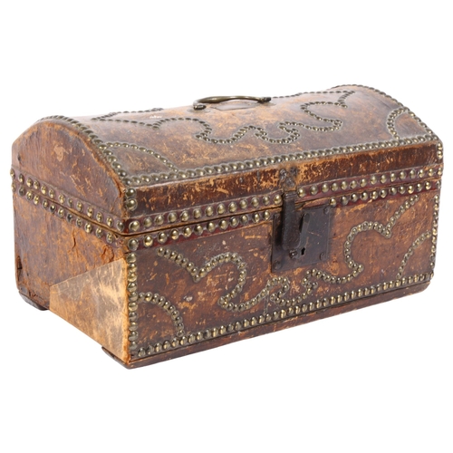 353 - A 18th century leather and studded brass dome-top box of small size, with brass carrying handle and ... 