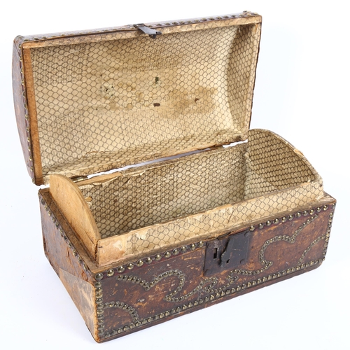 353 - A 18th century leather and studded brass dome-top box of small size, with brass carrying handle and ... 