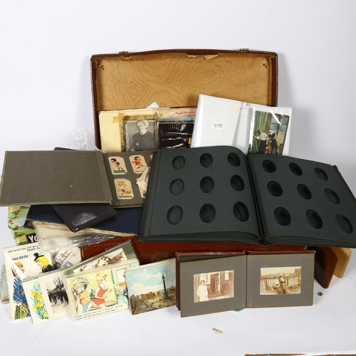 376 - A suitcase of postcards, ephemera, cigarette cards etc