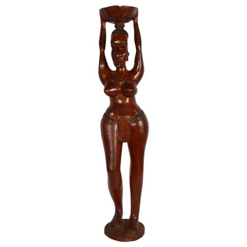 389 - A modern carved hardwood figure of a Tribal woman, H79cm