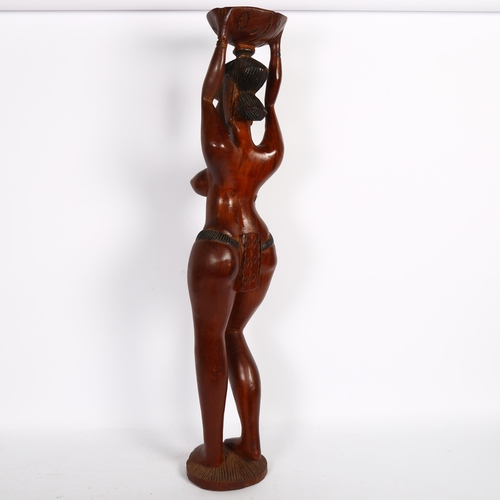 389 - A modern carved hardwood figure of a Tribal woman, H79cm