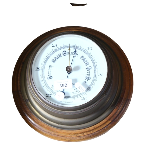 392 - John Barker & Company Ltd Kensington, an early 20th century brass-cased barometer mounted on a circu... 