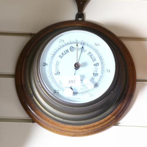 392 - John Barker & Company Ltd Kensington, an early 20th century brass-cased barometer mounted on a circu... 