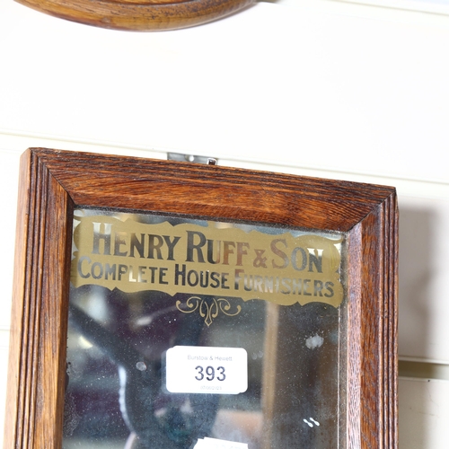 393 - Henry Ruff & Son Complete House Furnishers, a small oak-framed advertising mirror, 19 x 24cm