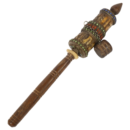 411 - A Tibetan prayer wheel, L27cm