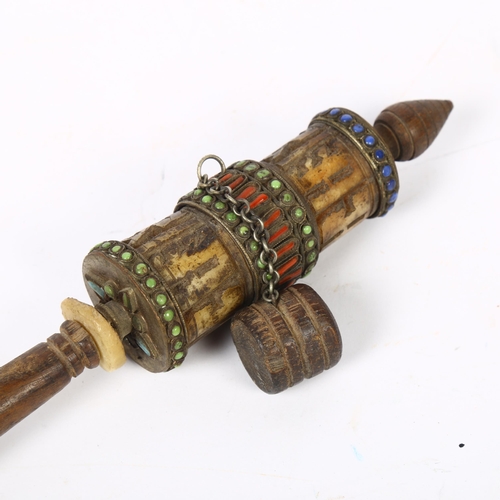 411 - A Tibetan prayer wheel, L27cm