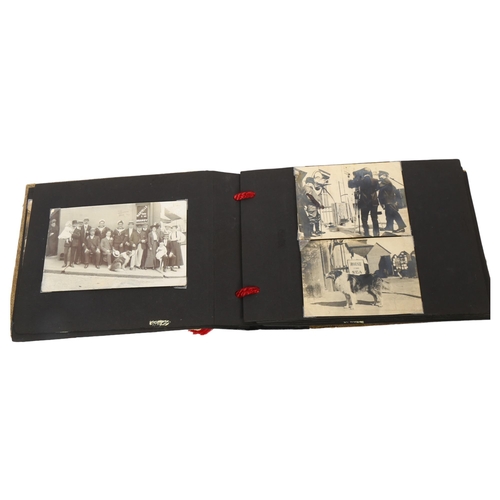 415 - An early 20th century photograph album, depicting the Pilot, the Dolphin, and various other scenes o... 