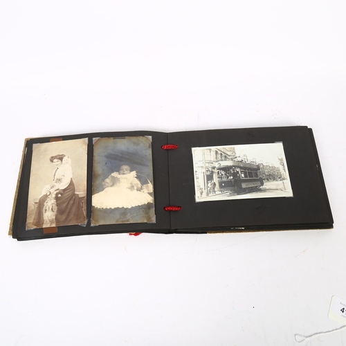 415 - An early 20th century photograph album, depicting the Pilot, the Dolphin, and various other scenes o... 