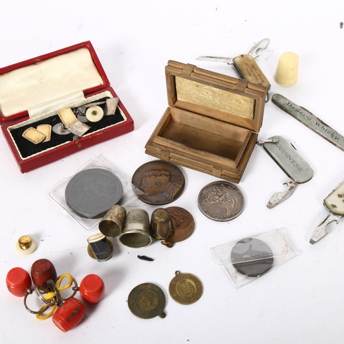 477 - A box of various items, to include silver cufflinks, cartwheel penny, penknives, thimbles etc