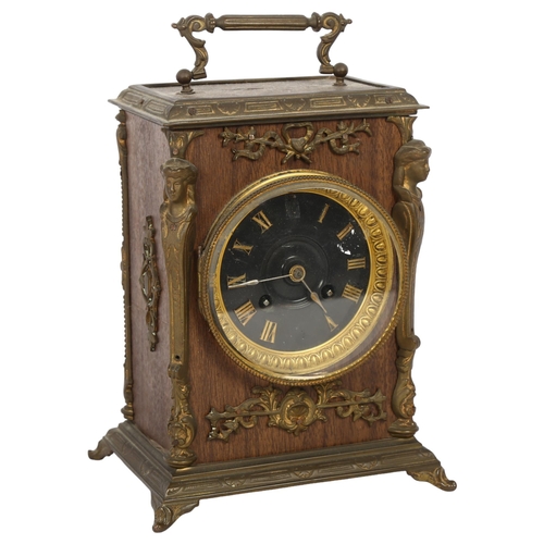 501 - An oak style mantel clock, 8-day movement striking on a bell, the clock covered in a brown finish fa... 