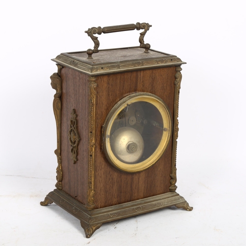 501 - An oak style mantel clock, 8-day movement striking on a bell, the clock covered in a brown finish fa... 