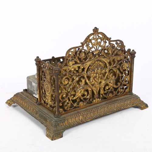 504 - An Antique gilt-brass desk stand, with fitted letter rack and 2 inkwells (inkwells not original), W2... 