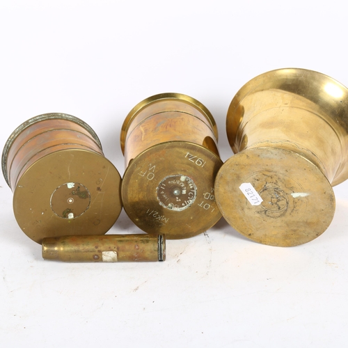 511 - A 1974 Mk II shell and cover, the cover inset with 19th century coin, a bronze mortar, a shell casin... 