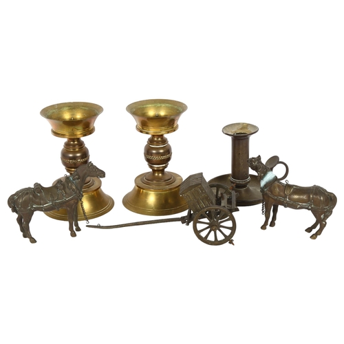 515 - A pair of turned brass candlesticks, a brass chamber stick, and 2 brass horses and carriage (5)