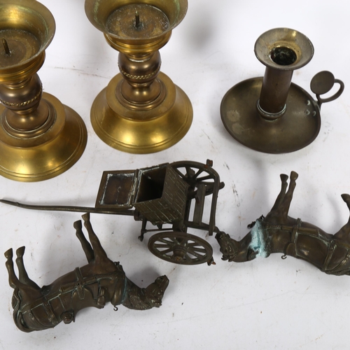 515 - A pair of turned brass candlesticks, a brass chamber stick, and 2 brass horses and carriage (5)