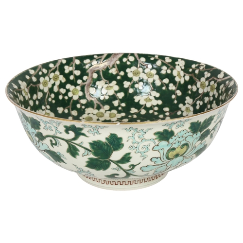 527 - A large Chinese green enamelled and prunus decorated centre bowl, diameter 30cm