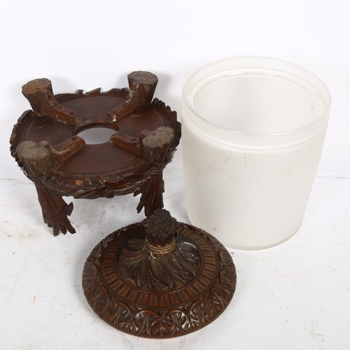 531 - A Black Forest design biscuit barrel, with acanthus leaf carved lid and wheatsheaf knop, sitting in ... 