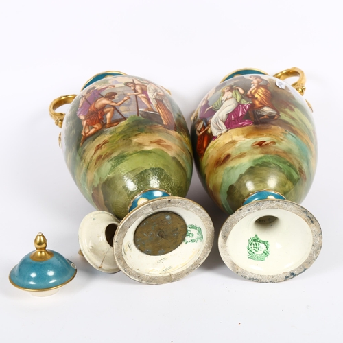 542 - A pair of early 20th century Continental urns and covers, with transfer printed panels and gilded de... 