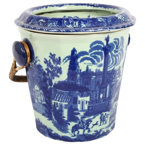 543 - A reproduction blue and white slop bucket with wicker handle, H28cm