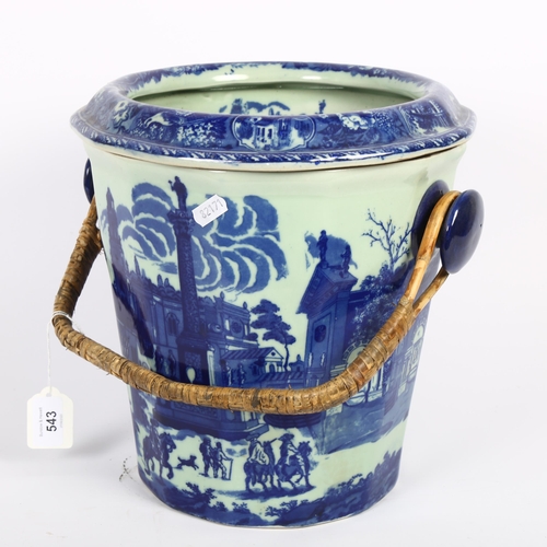 543 - A reproduction blue and white slop bucket with wicker handle, H28cm