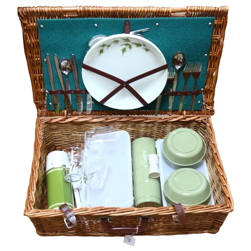 550 - A wicker picnic hamper and contents