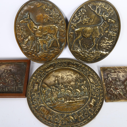 566 - A group of bronze plaques, including 2 oval designs, 1 depicting a stag and a second depicting a doe... 