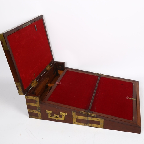 576 - A Victorian mahogany and brass-bound travelling writing slope, L36cm, H13cm, D26cm