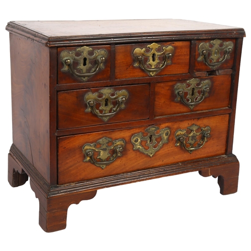 577 - An early 19th century table-top chest of 6 drawers of varying sizes, H29cm, L38cm, D20cm