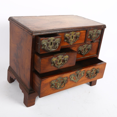 577 - An early 19th century table-top chest of 6 drawers of varying sizes, H29cm, L38cm, D20cm