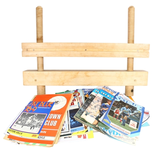 587 - A bookbinder's laying press, medium size, 68 x 49 x 8cm, and a large collection of Vintage football ... 