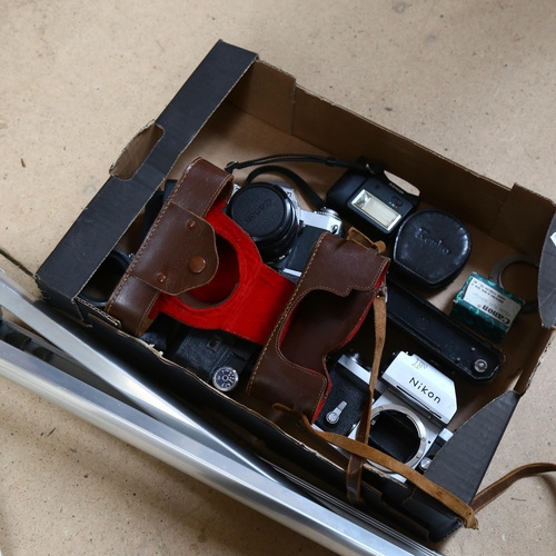 633 - A quantity of Vintage cameras and equipment, including a Canon AV-1, with associated lens (FD50MM1..... 