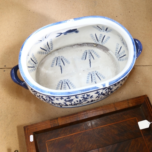 824 - Inlaid 2-handled tea tray on brass feet, and a reproduction blue and white printed footbath, L57cm o... 